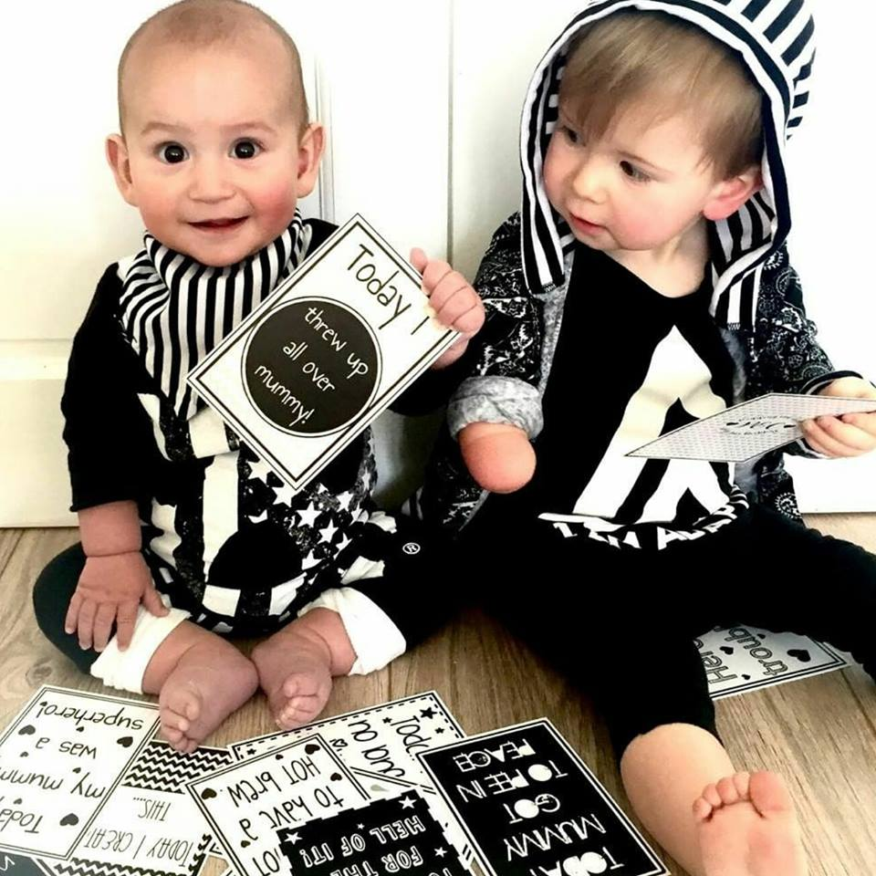 boys with their milestone cards