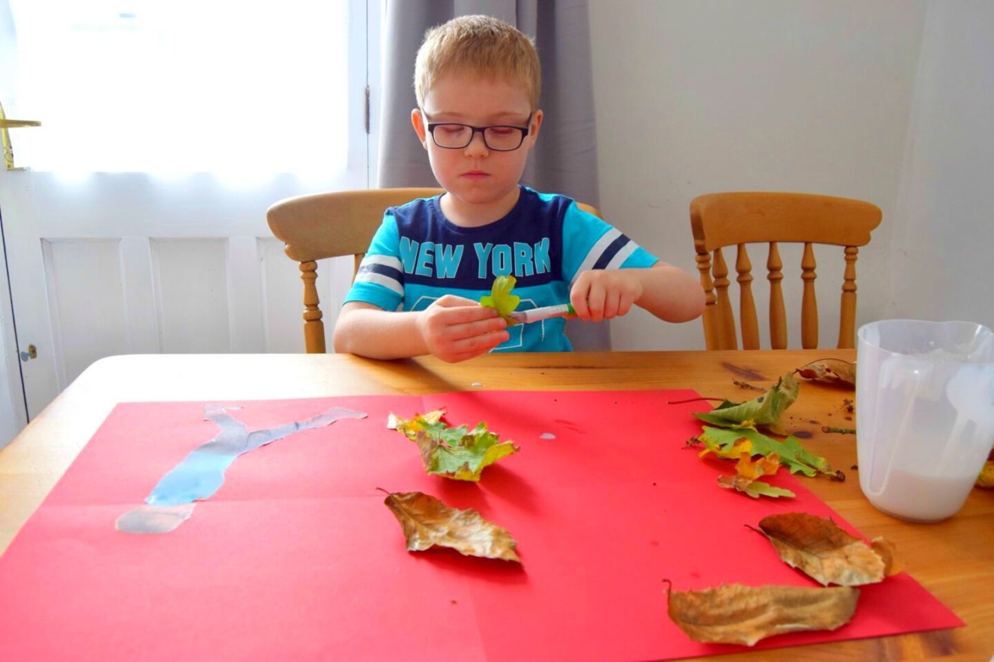 Making a leaf collage with our autumn finds