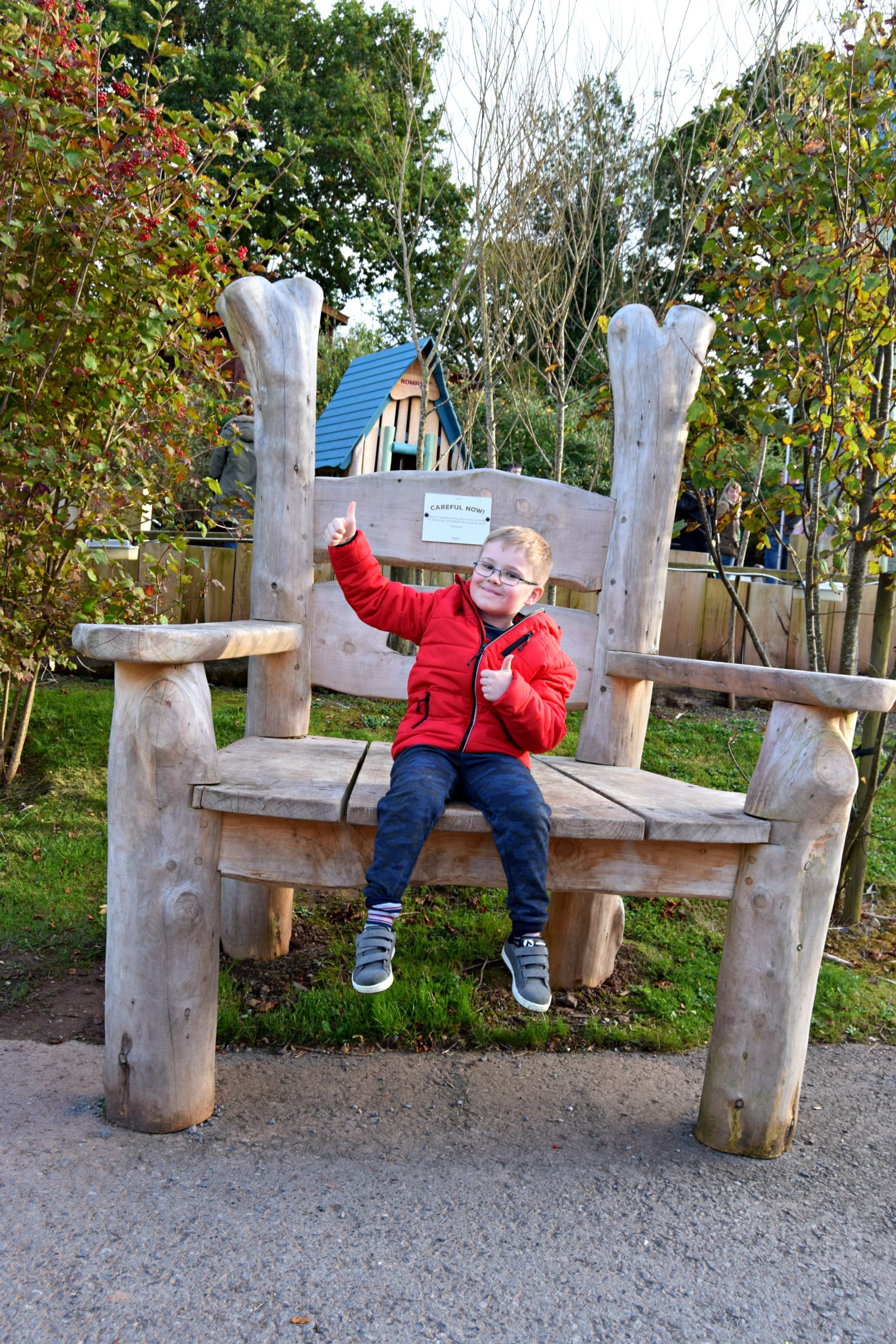 Jayden sitting on the giant chair at Bluestone. Living Arrows.