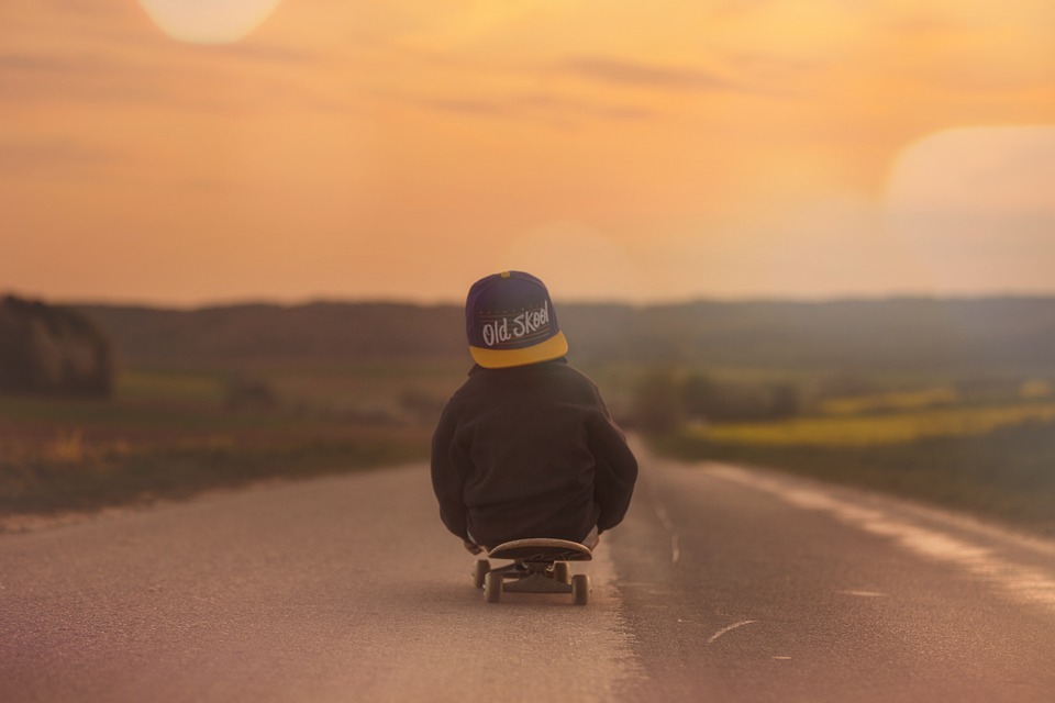 A little boy having fun on his skateboard. 
