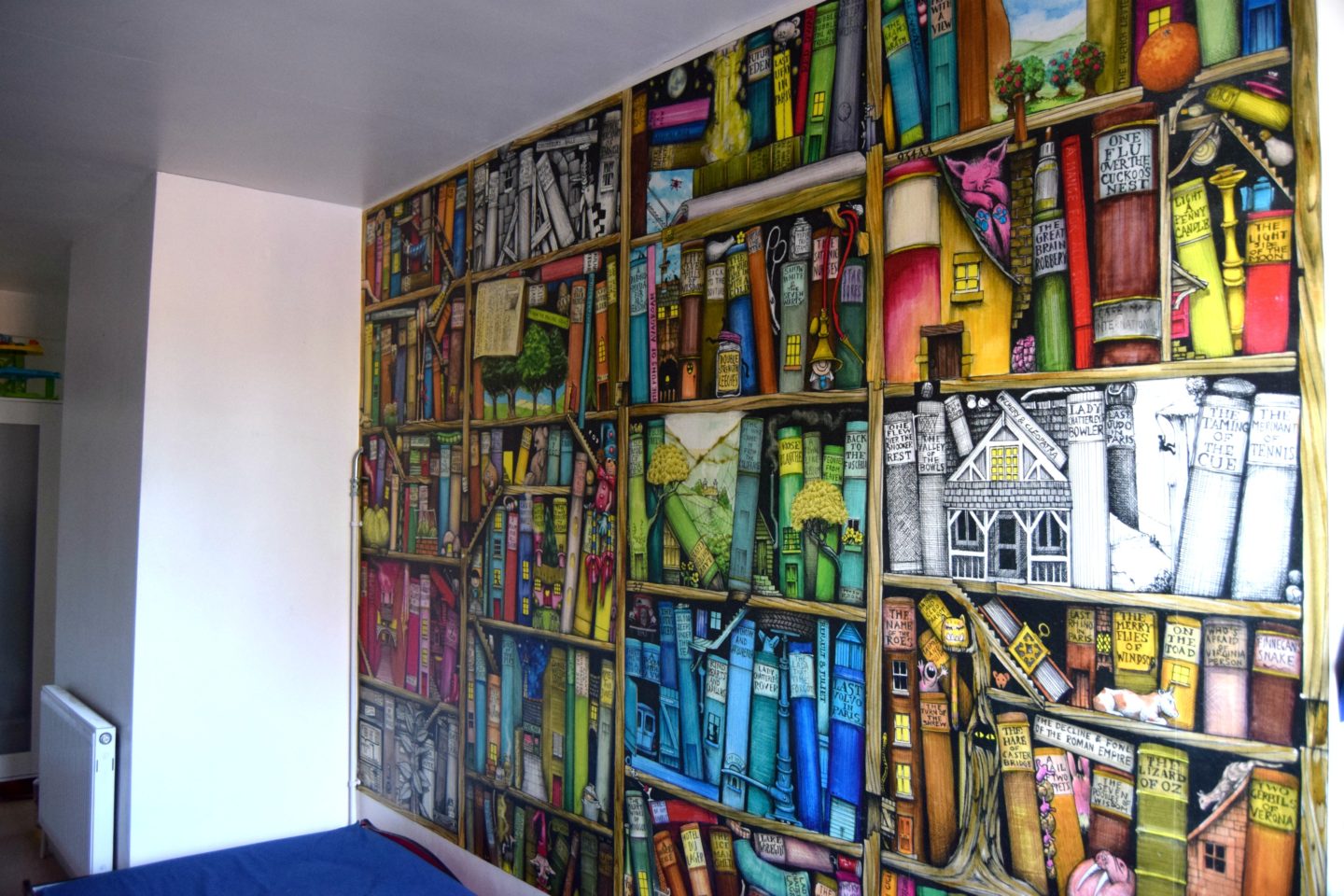 kids bedroom mural of a fantasy bookshelf.