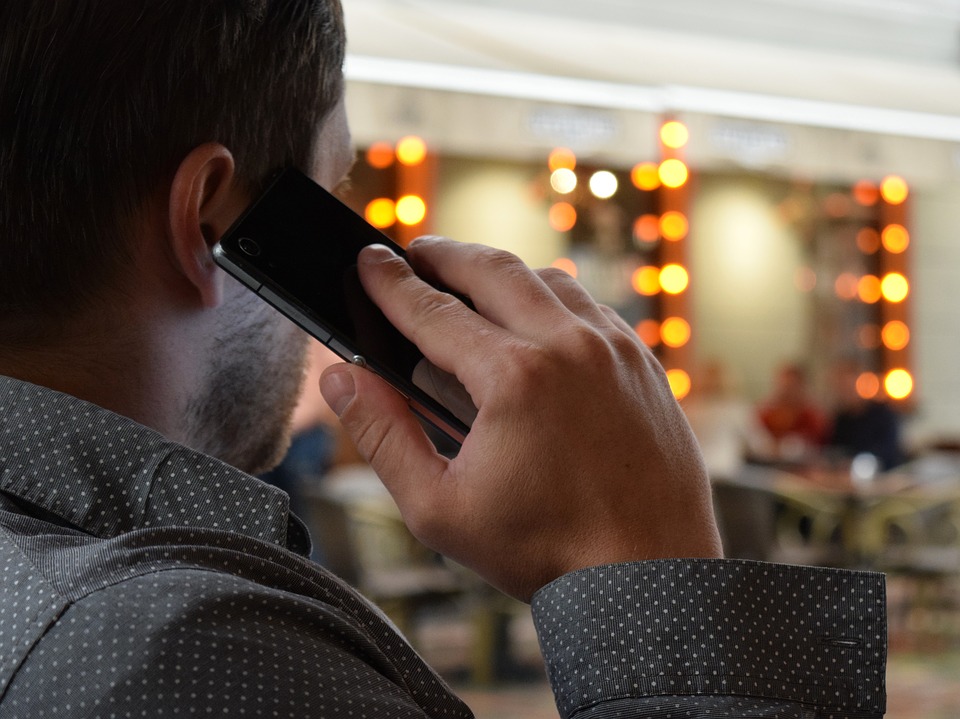 Customer service. Man making a phone call.