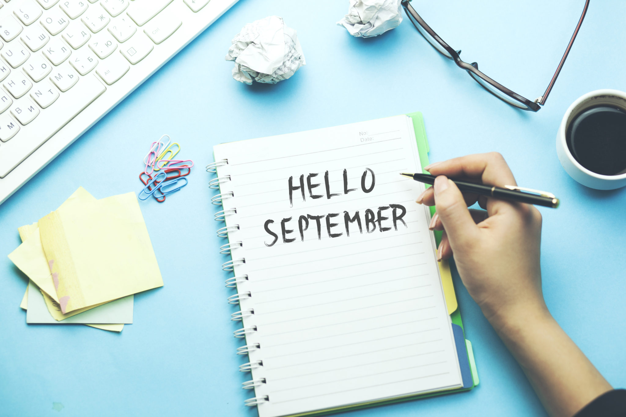 A notebook on a desk reading Hello September. #MMBC blogging club. Blog Linky.