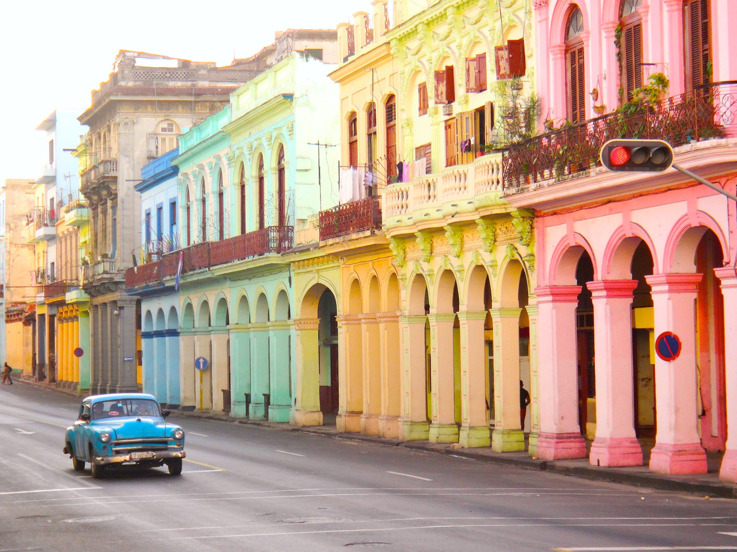 Vintage car driving through Havana, Cuba.