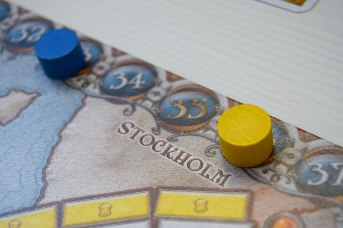 Ticket to ride Europe board game blue and yellow wooden counter playing pieces.