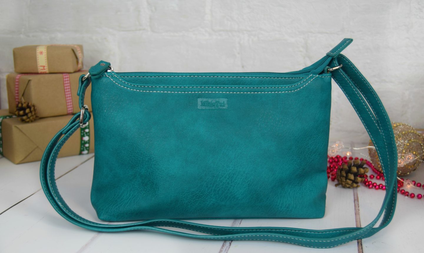 Mia Tui cross-body bag in green.