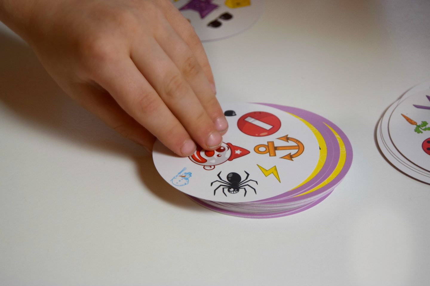 Turning the Dobble card over to see who can get the first match!