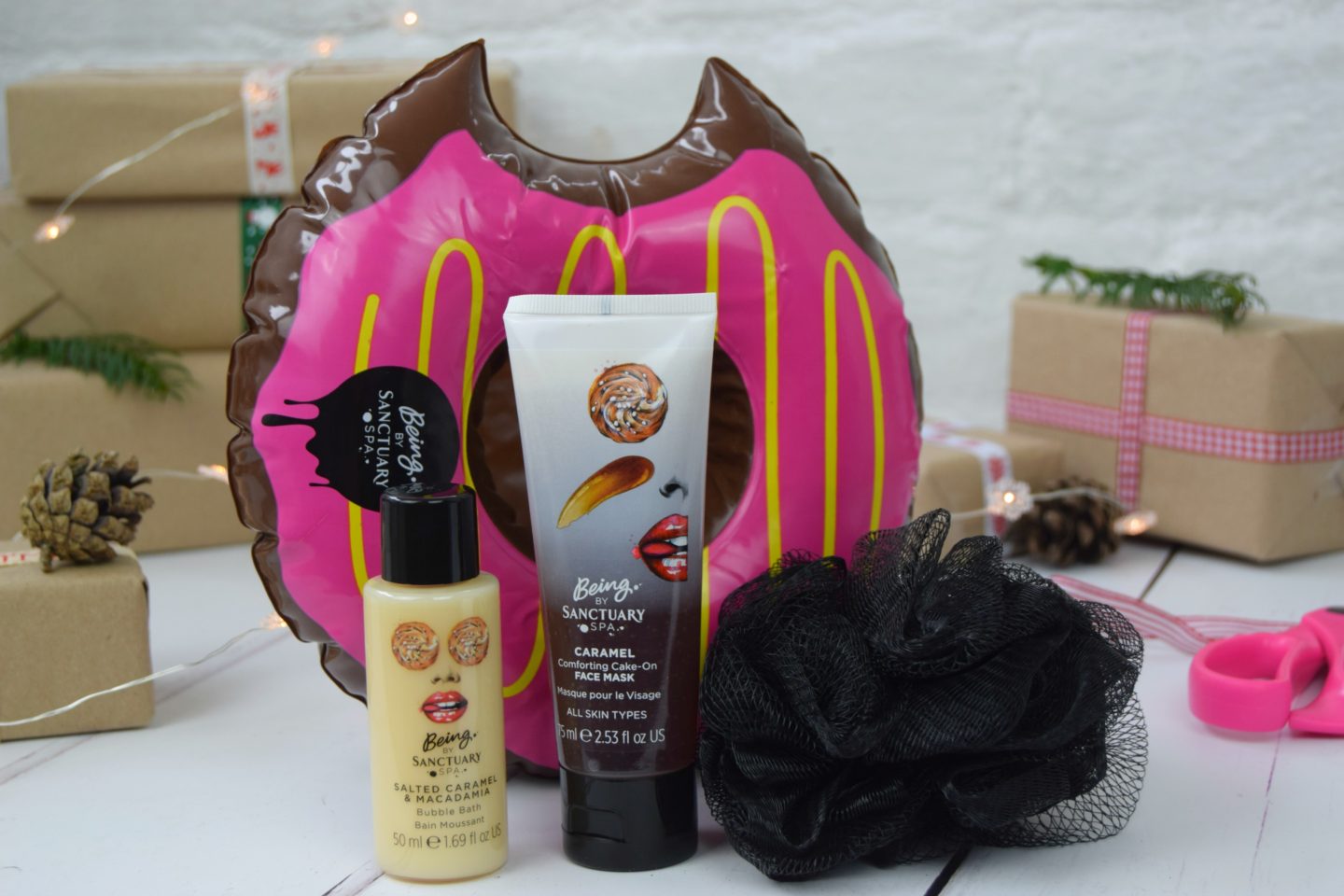 Sanctuary Spa donut gift set with face mask, cream and a floating donut cup holder for the bath.