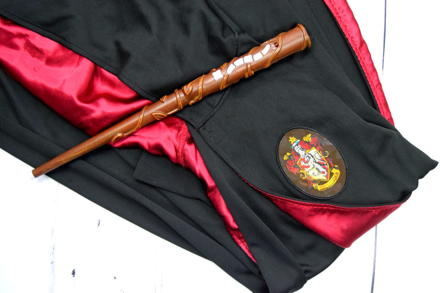 Harry Potter toy wand and gryffindor magic gown costume.