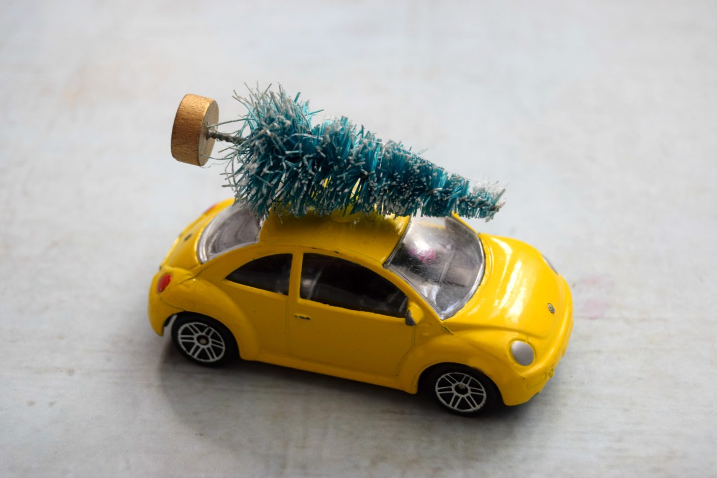 car carrying a Christmas tree on roof 1