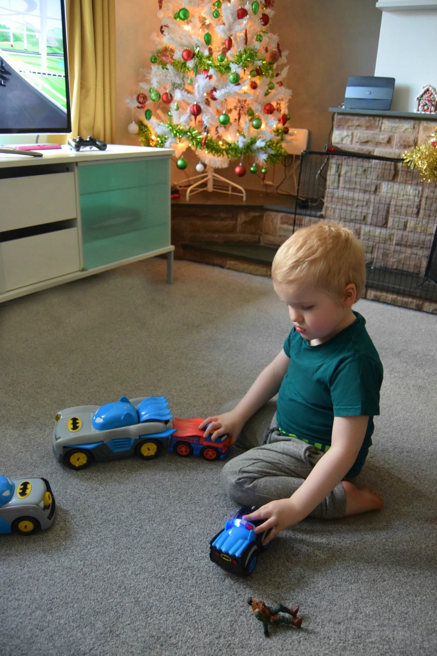 My son playing with his Herodrive DC Super Friends vehicle collection.