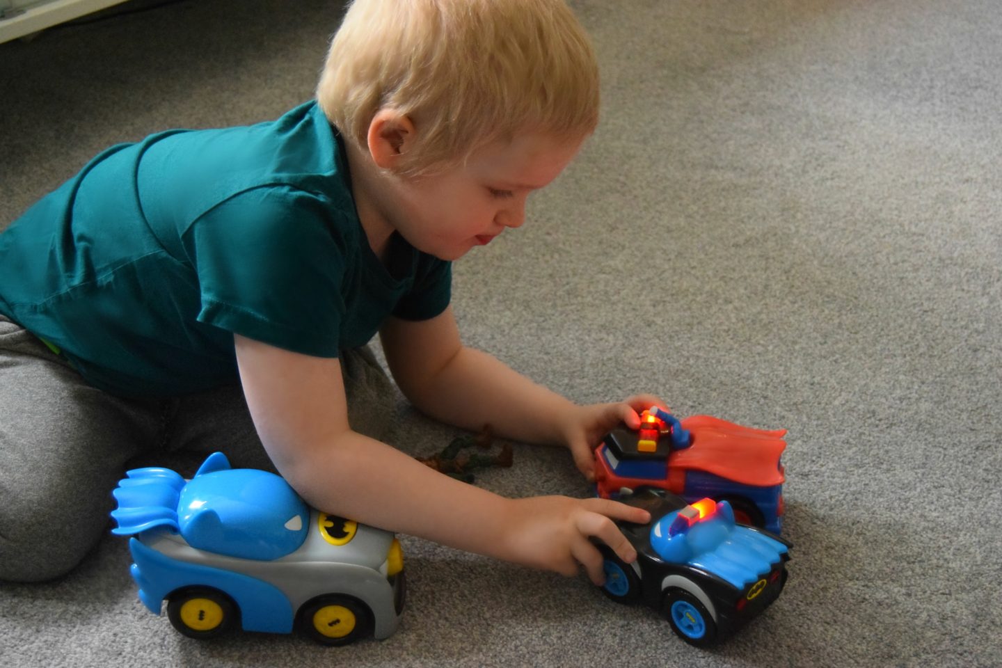 My son playing with his DC Super Friends Herodrive toy cars.
