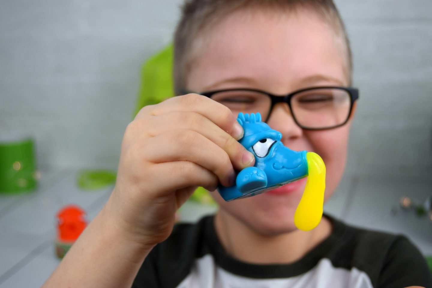 Yellow slime hanging from the blue Slurpees snot suckers mouth.