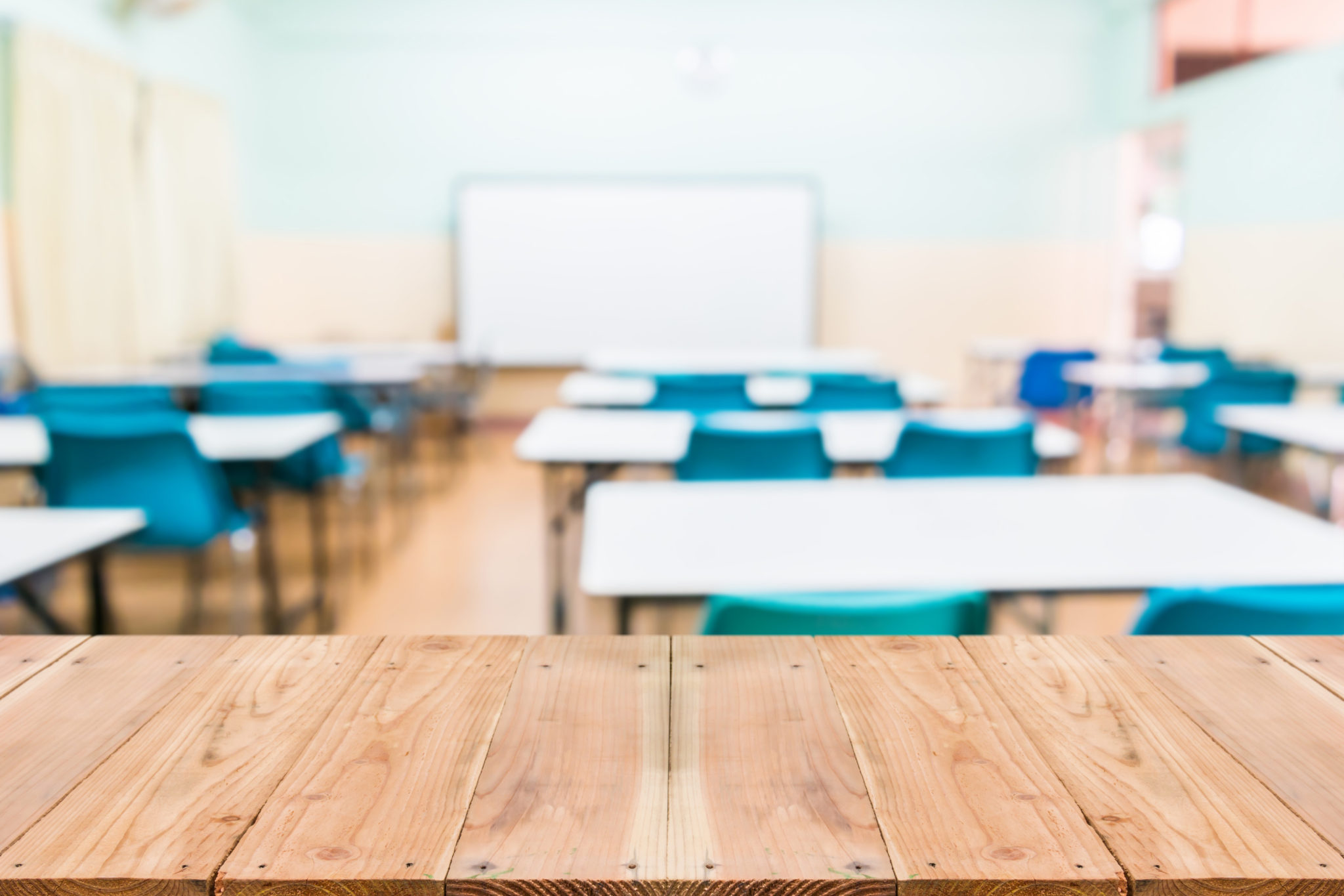 Classroom desks with blue chairs