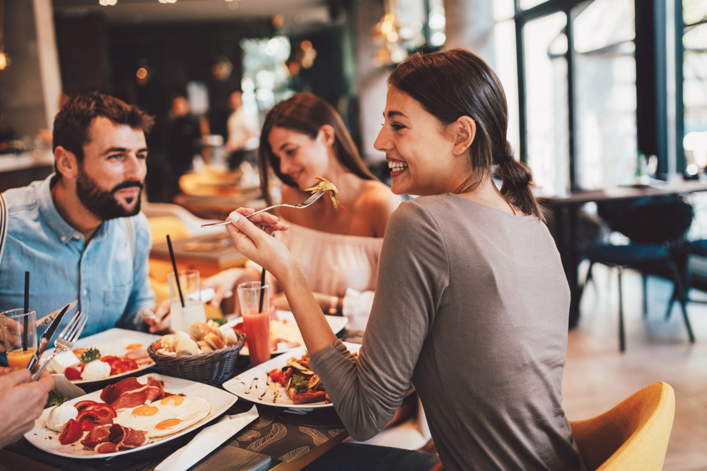 Friends having breakfast together in a restaurant