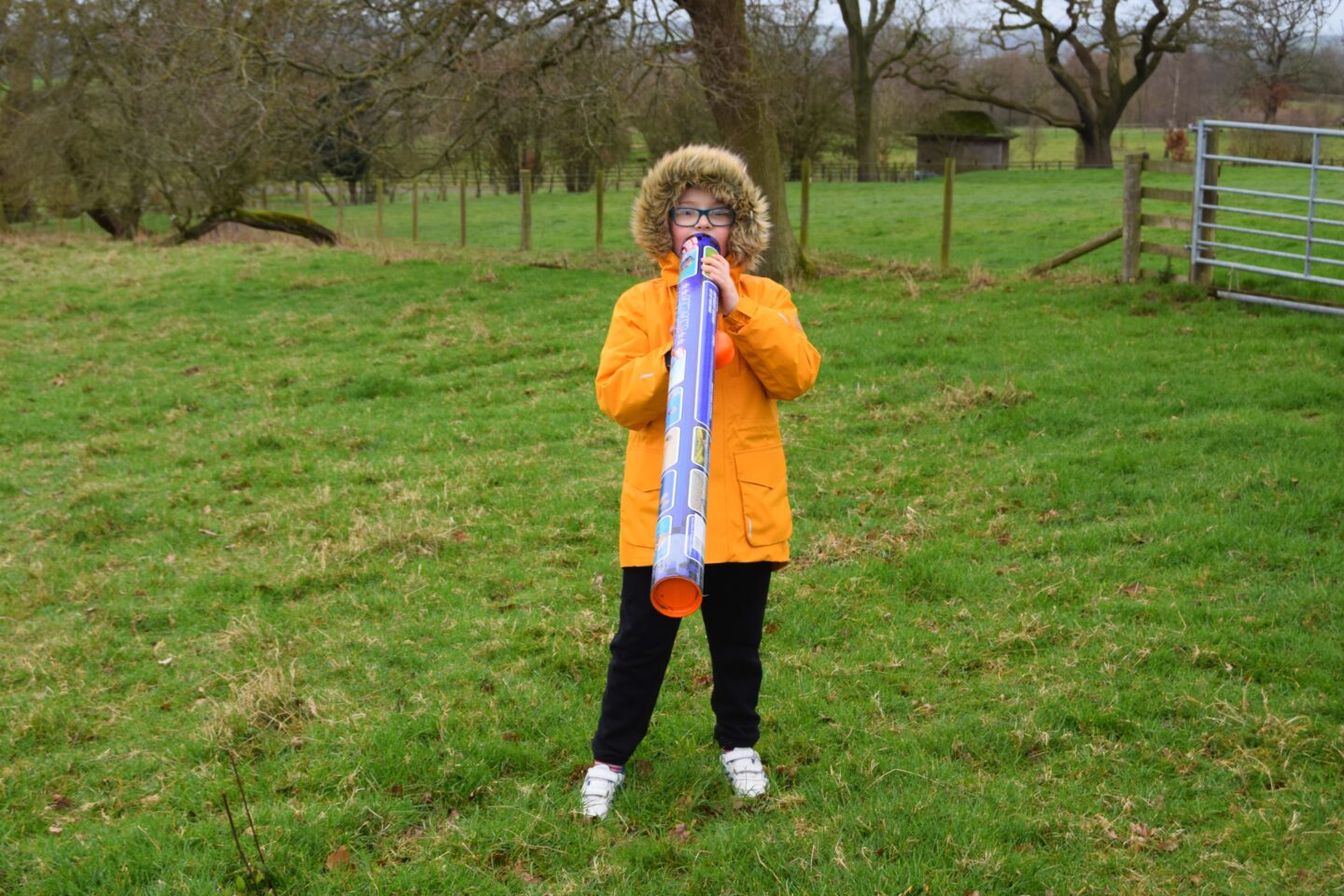 My boy holding the kite tube and pretending to play the didgeridoo!