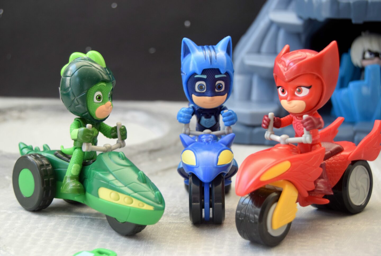 Catboy, Ghecko and Owlette toys riding their rover vehicles.