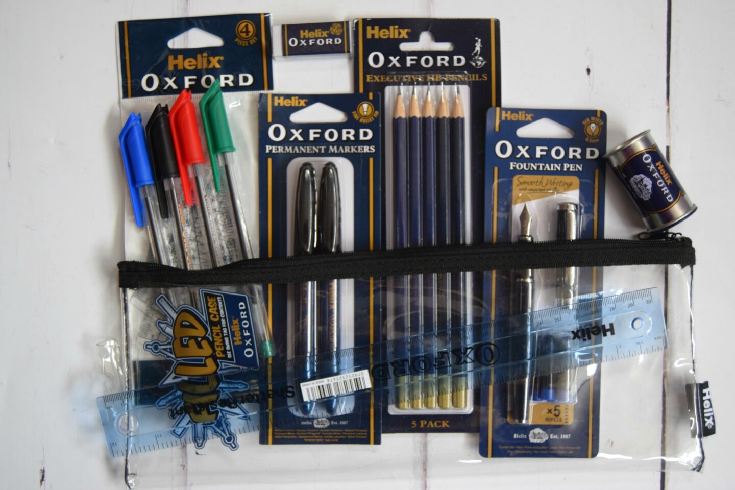 Office stationery including pens, pencils, pencil case, pencil sharpener and ruler.. National stationery week.