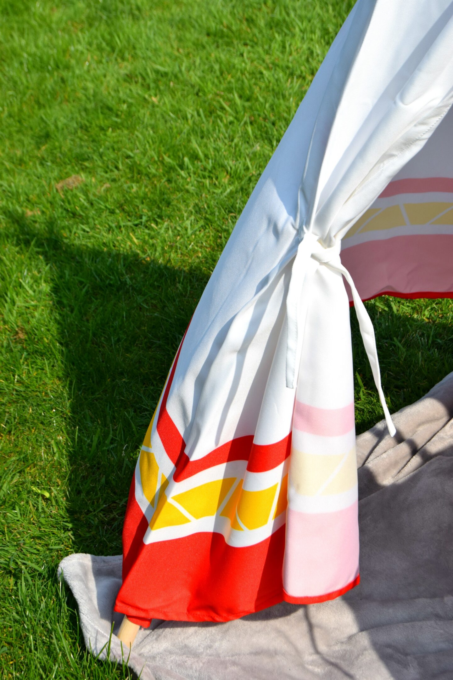 Tie sides on the Hape canvas teepee
