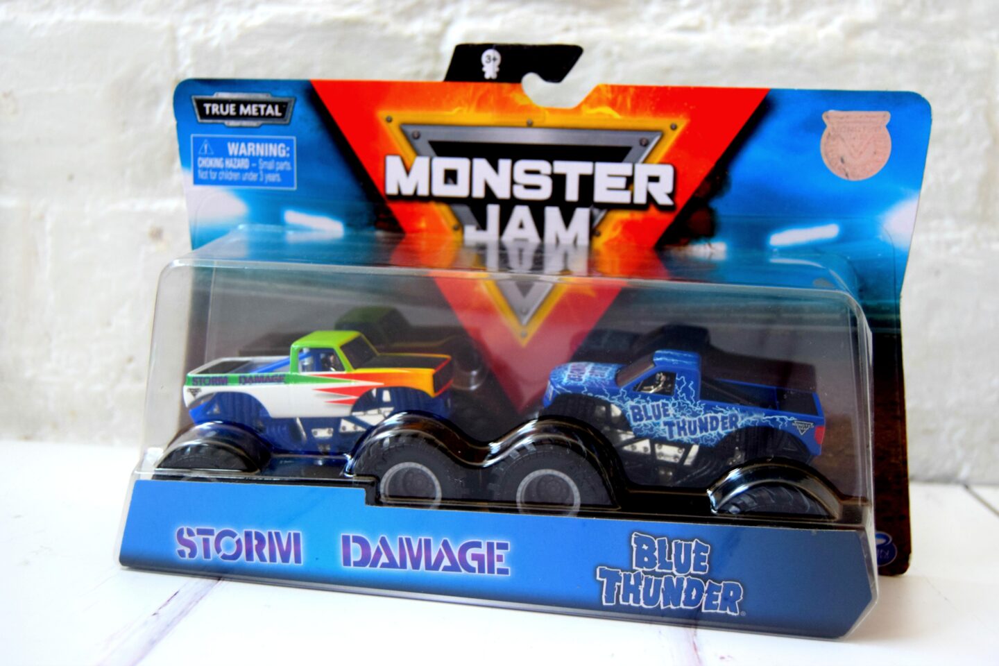 Spinmaster Monster Jam Monster Truck Toys. Die cast monster trucks. Storm Damage and Blue Thunder.
