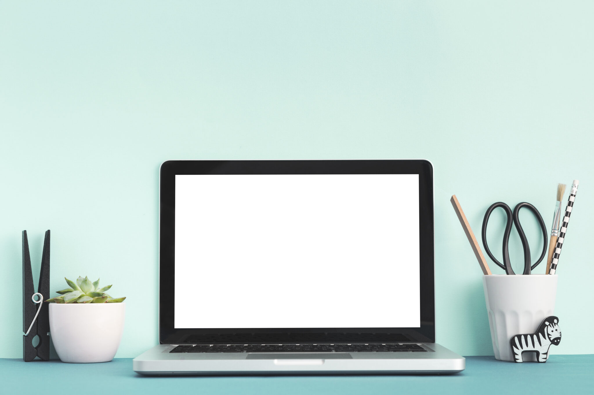 Monday Morning Blog Club. A desk workspace with monitor, pencil holder and succulent.