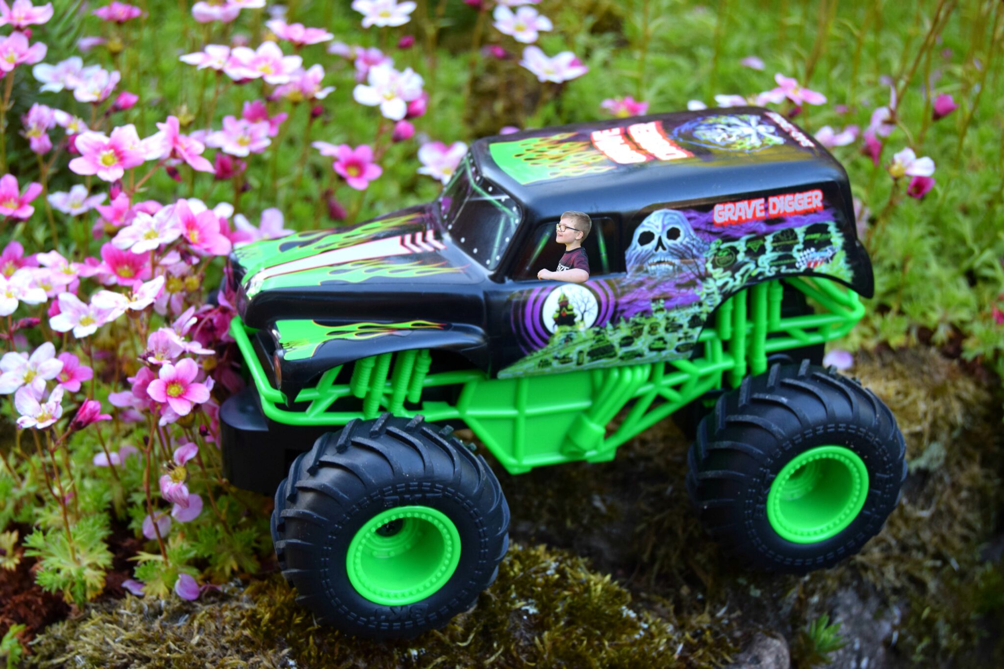 Jayden driving his remote control monster jam grave digger monster truck