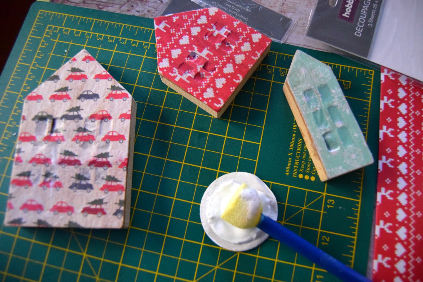 Decoupage houses with mod podge