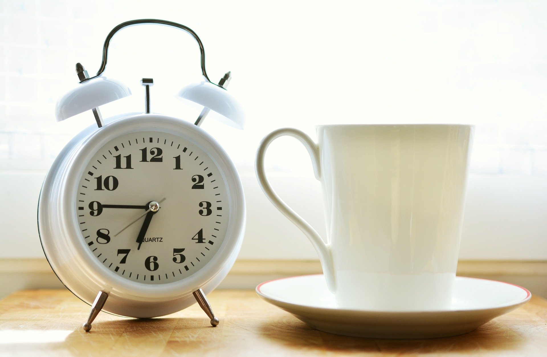 Monday Morning Blog Club. Alarm clock and cup of tea