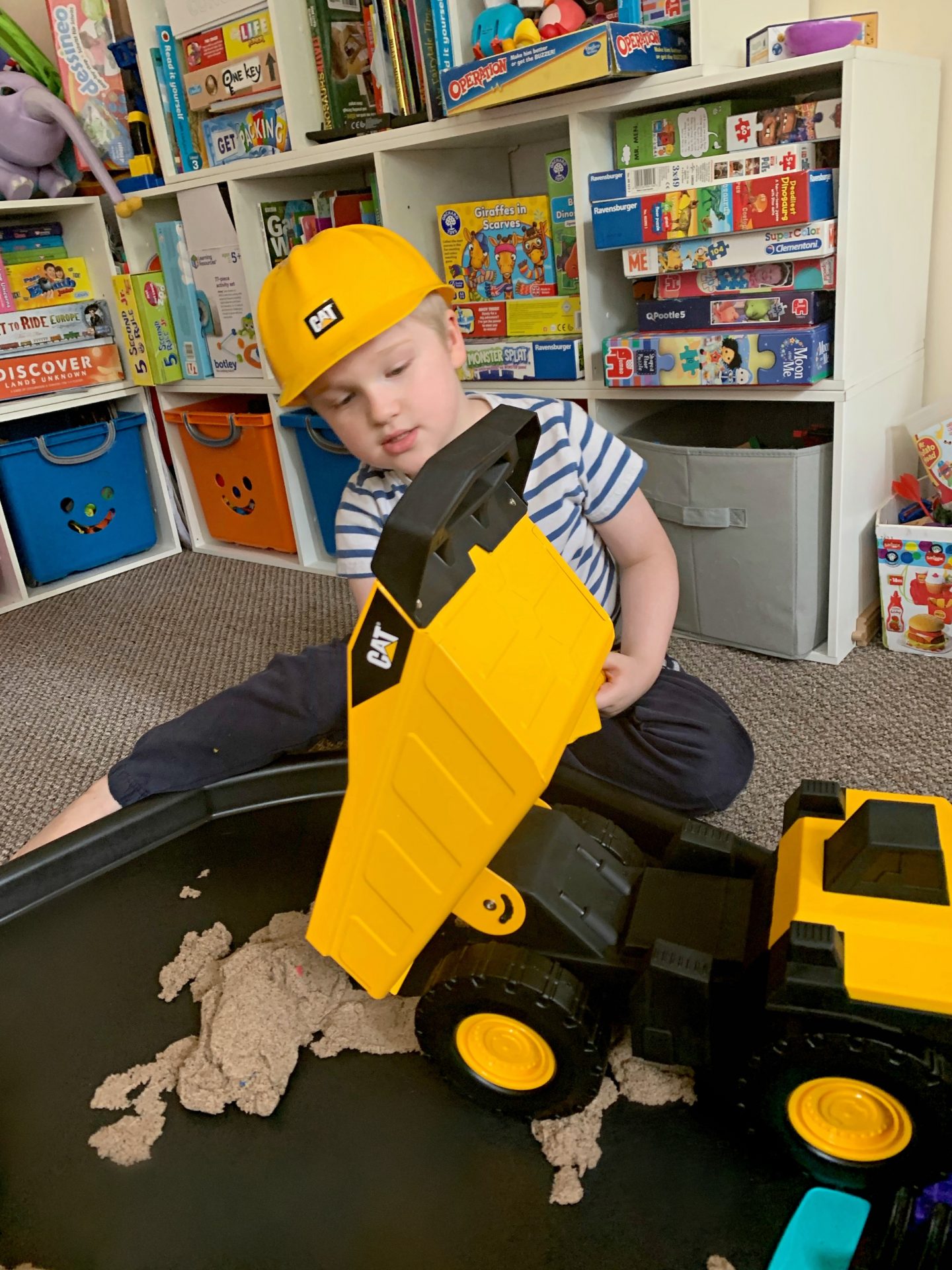 JJ playing with the CAT dumper truck