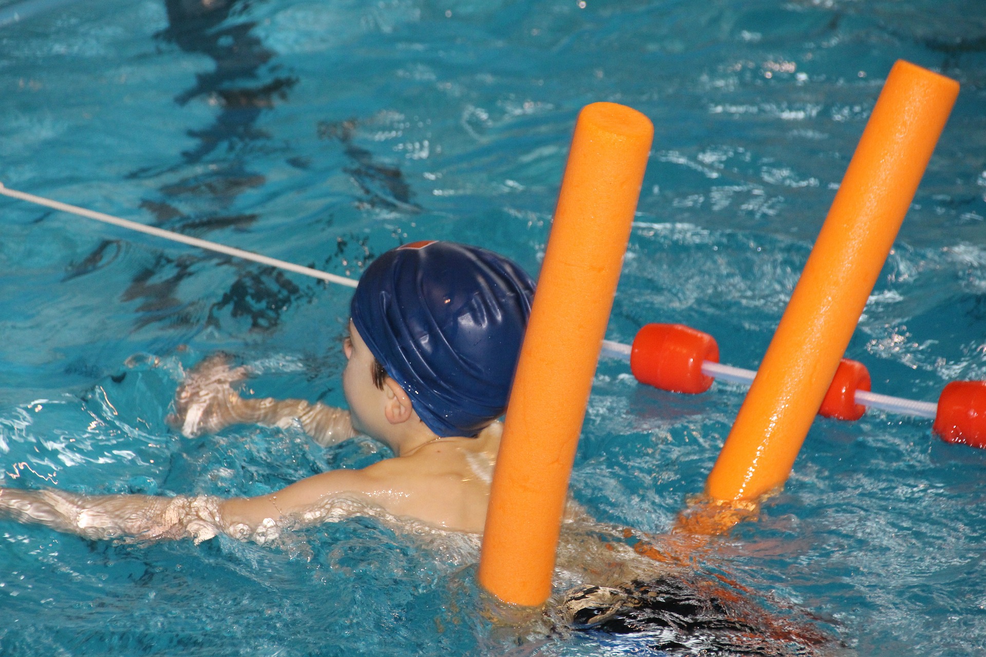A boy having swimming lessons.