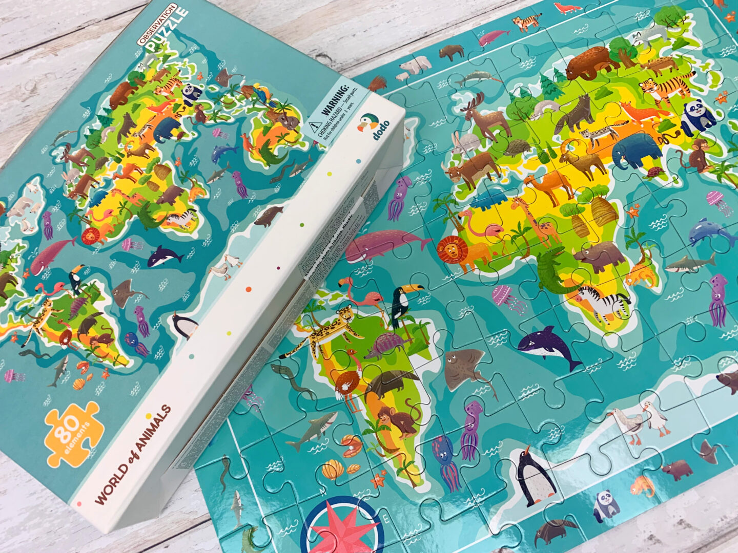 Observation jigsaw puzzle with images of animals around the globe.
