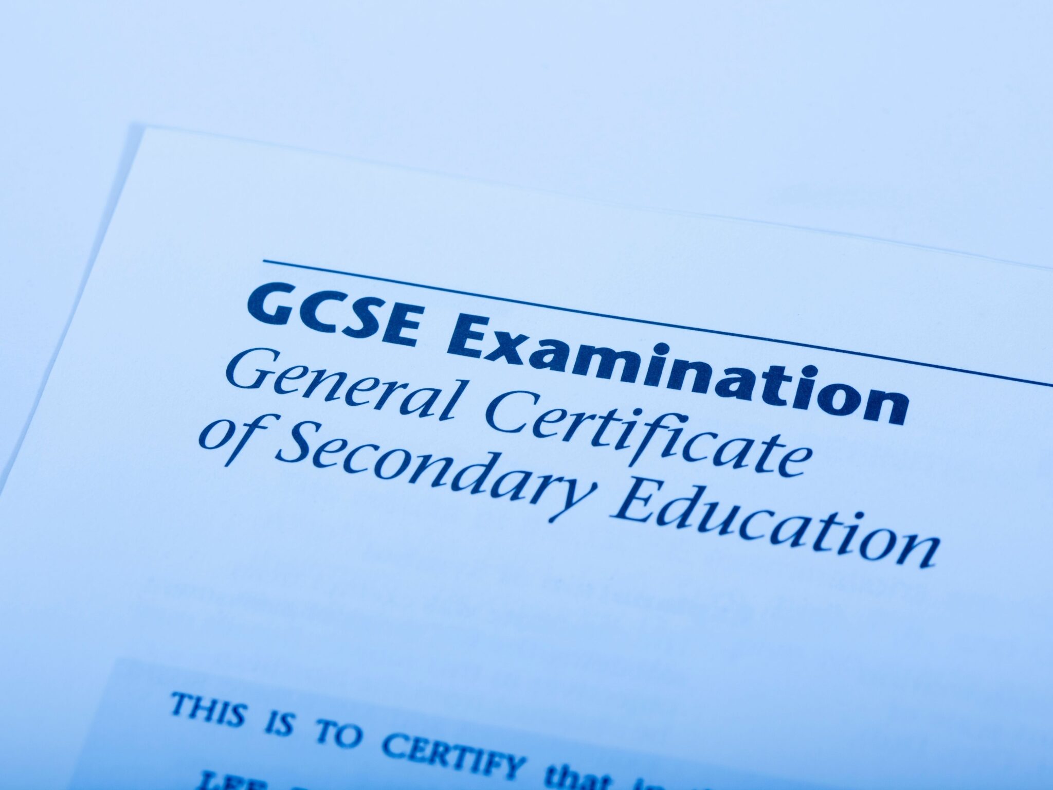 A GCSE examination paper on a desk