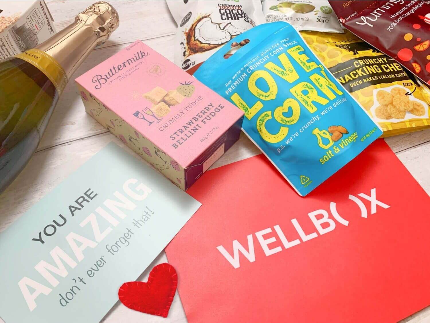 Wellbox wellbeing hamper with fudge, nuts, drinks and more.