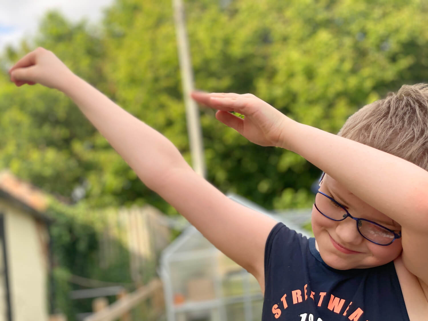 A boy dabbing