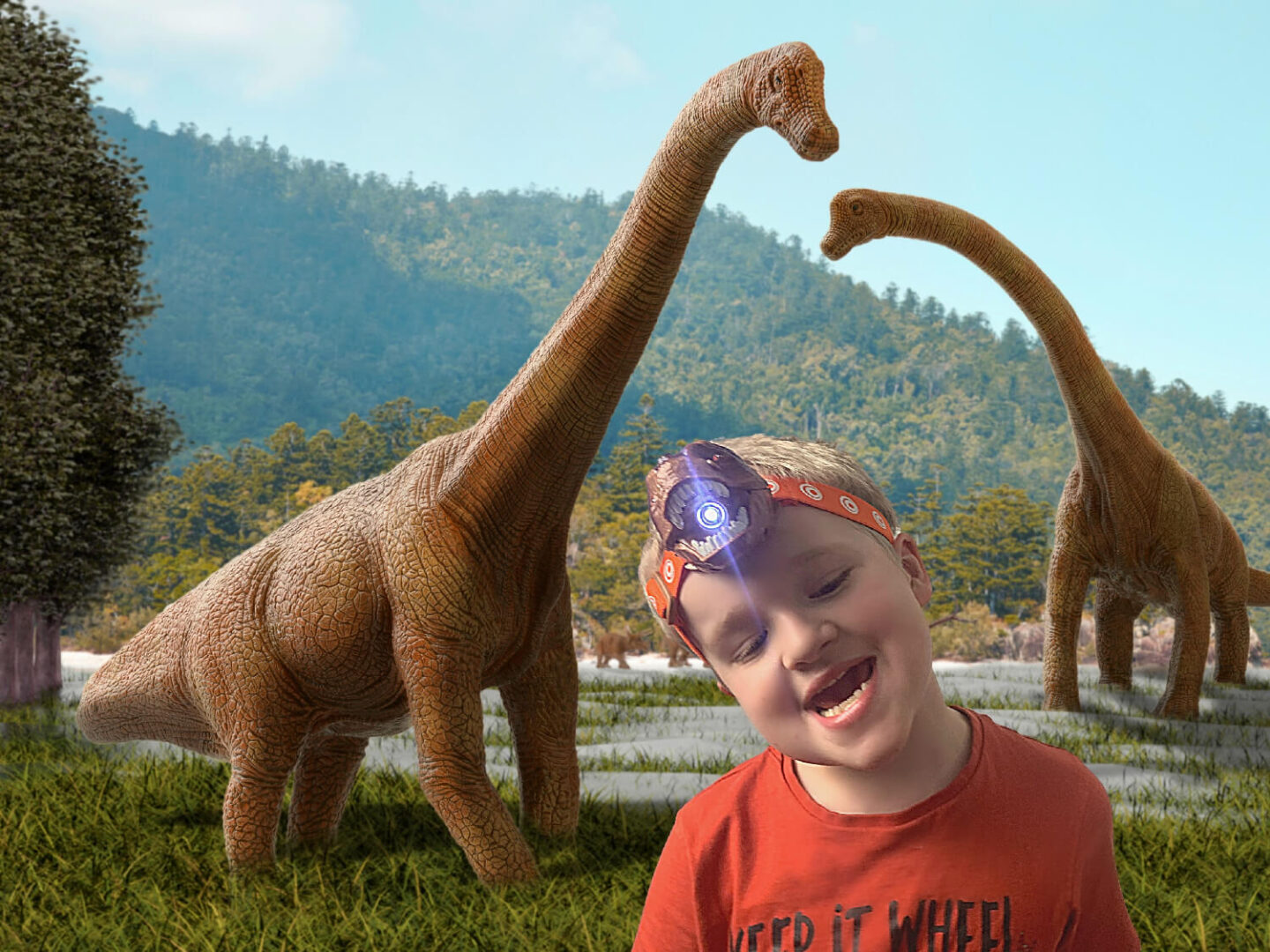 My youngest wearing a dinosaur T-Rex head torch that also roars.