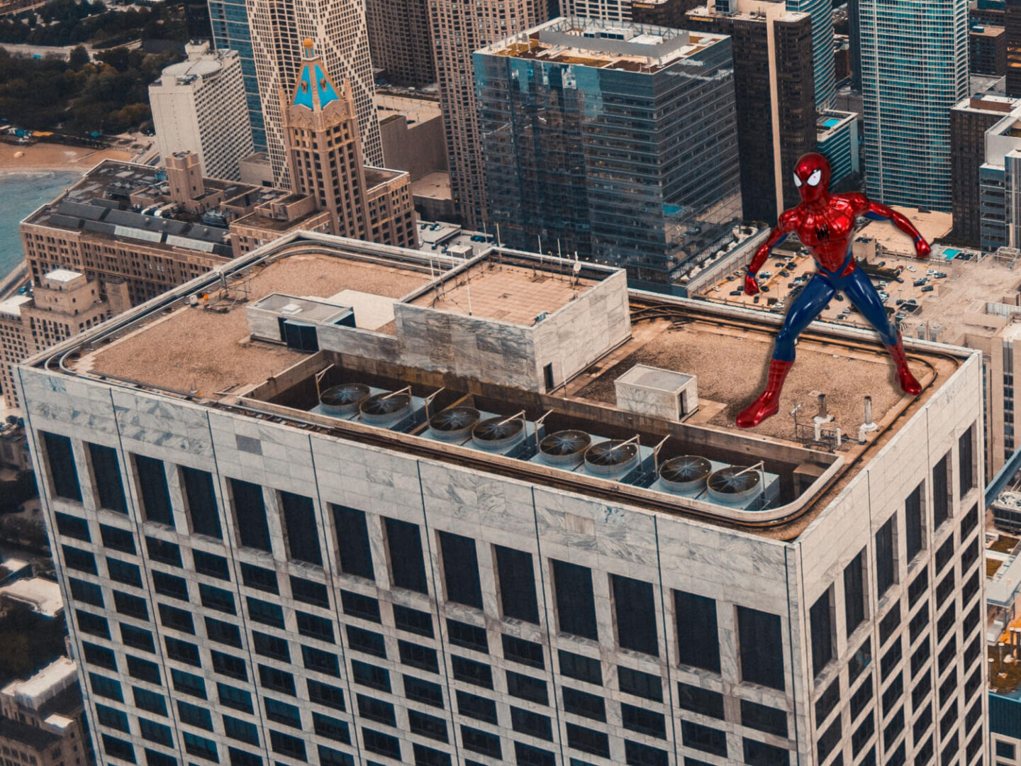 A Spiderman figure on top of a rooftop scene.