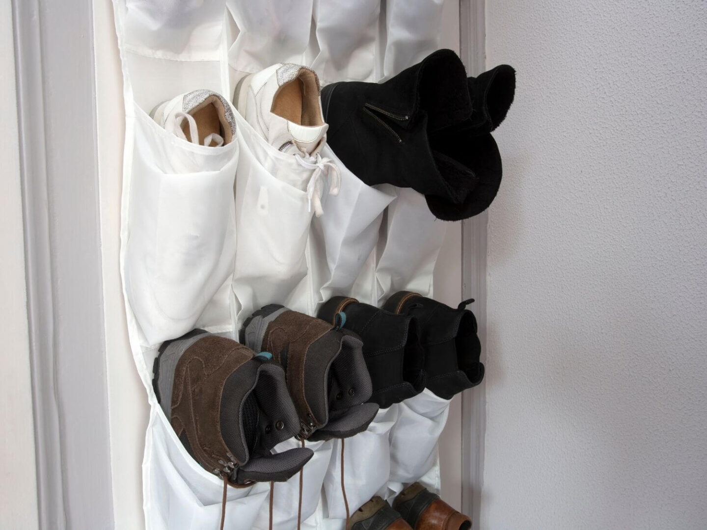 A door hanging canvas sheet with pockets to hold shoes.