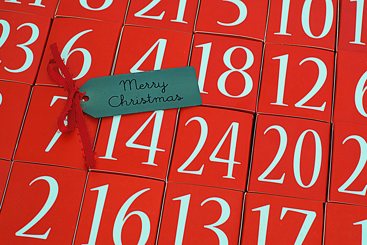 A red wooden box advent calendar with white numbers