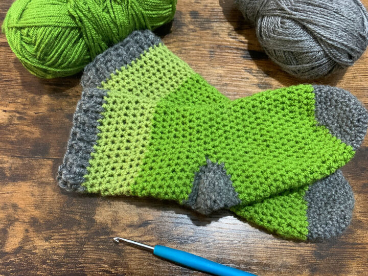 green and grey crocheted socks with a free pattern