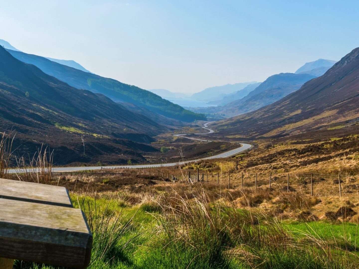 Part of the North coast 500 with breathtaking views of hills all around and blue sky.