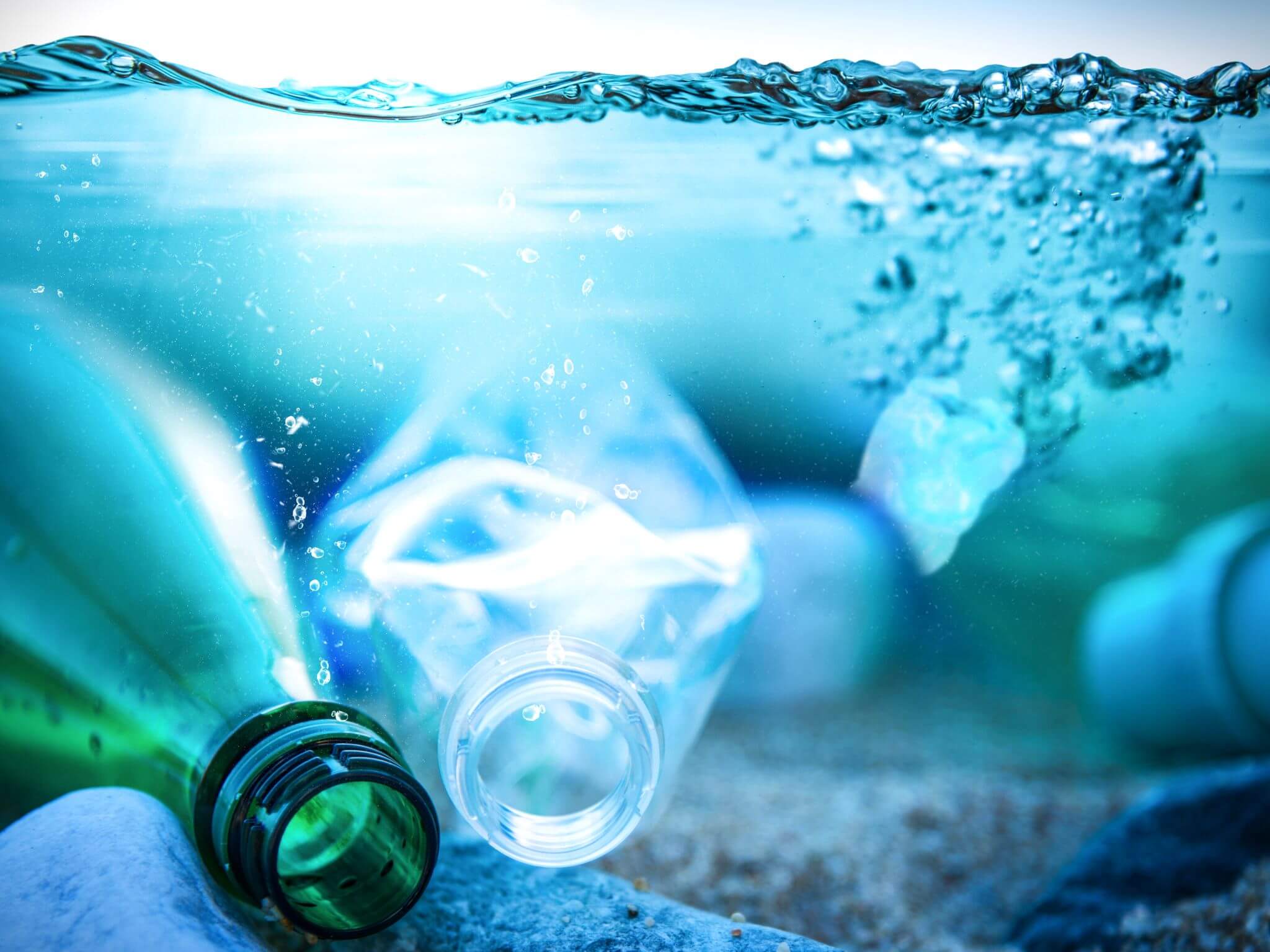 Plastic bottles sitting in the ocean