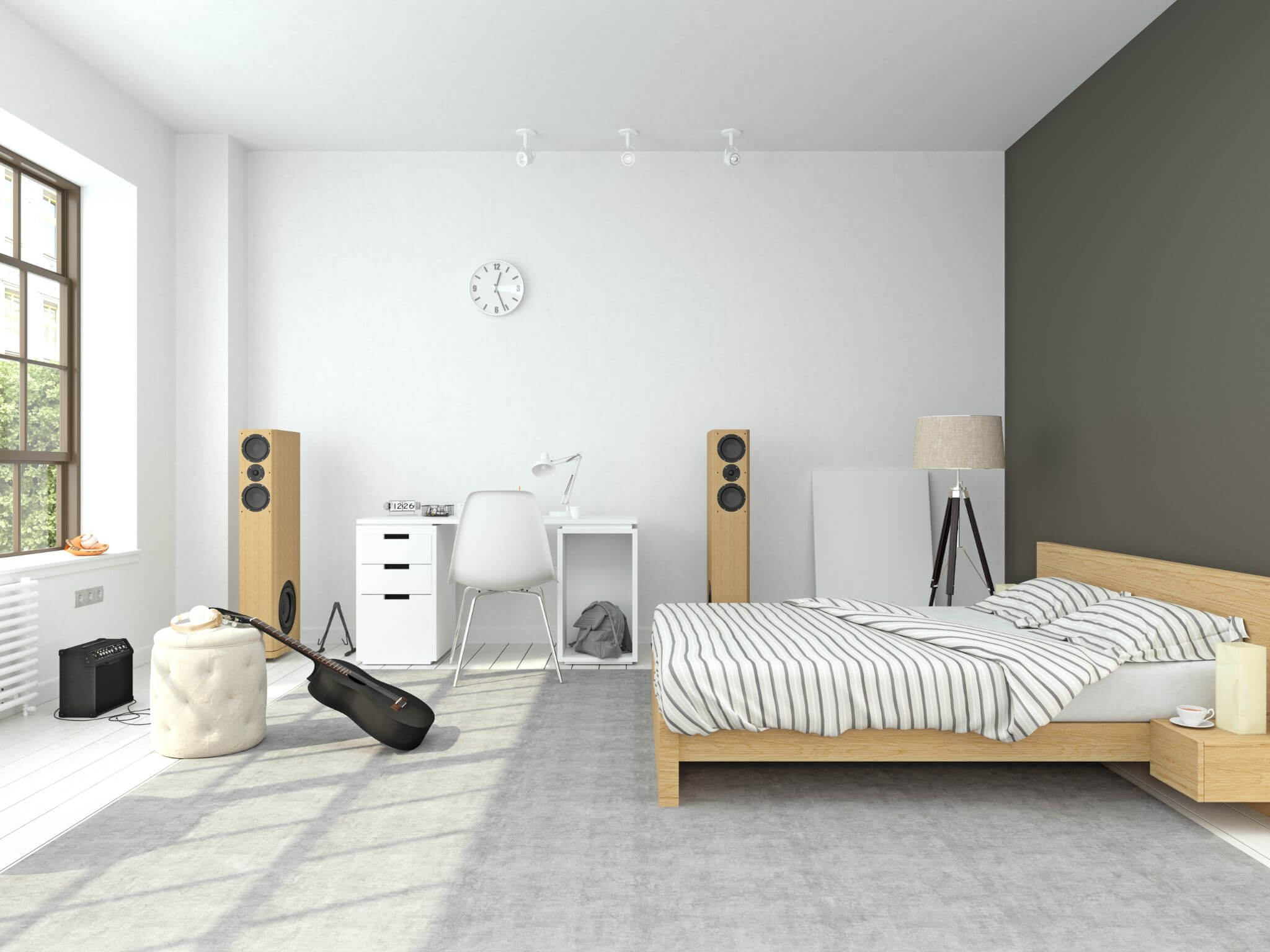 A white bedroom with a pine doule bed and large speakers on one wall and a black guitar at the end of the bed.
