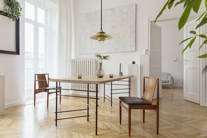 Vinyl flooring in a dining room. The room is white and airy.