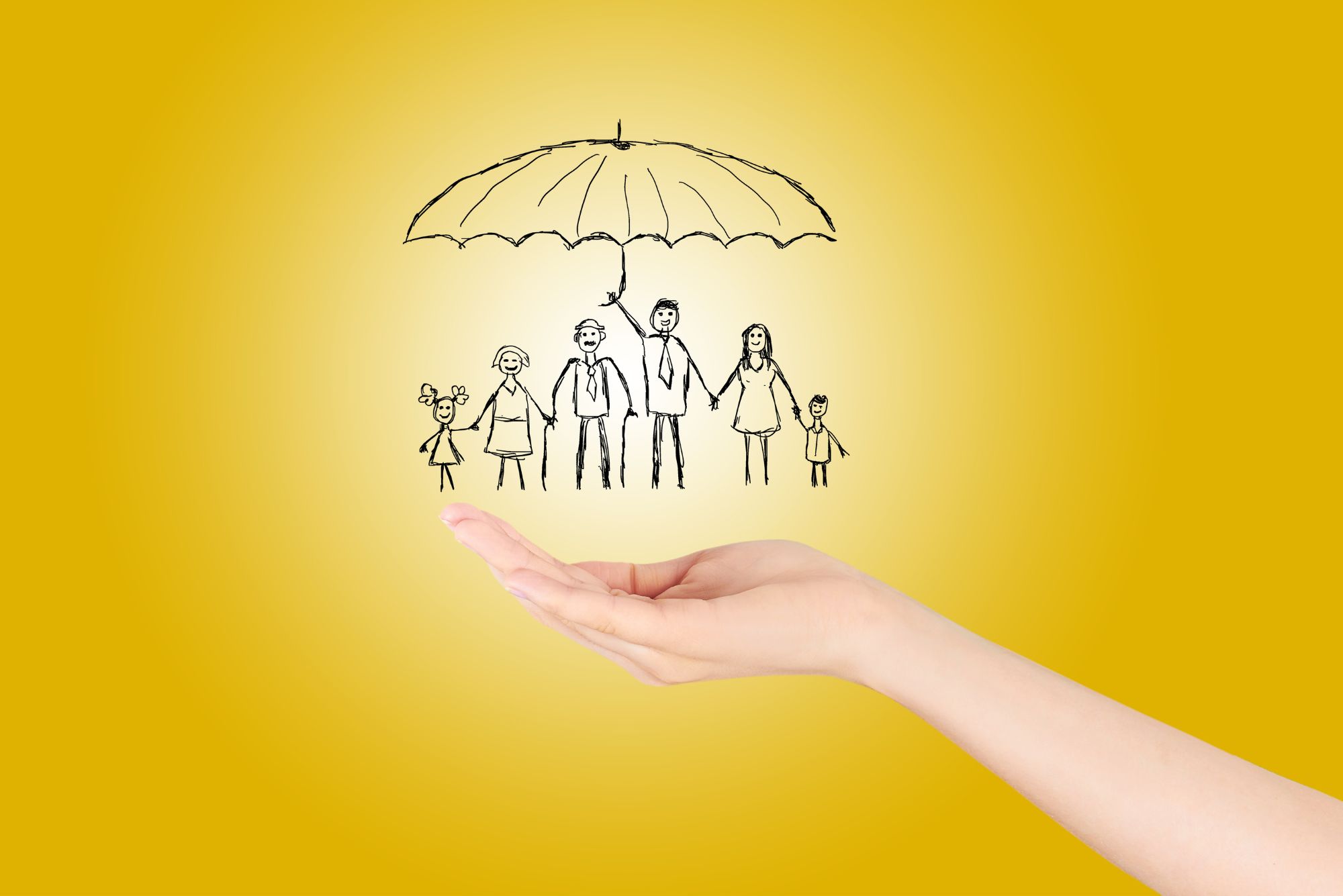 A hand holding a family of sketched matchstick people.