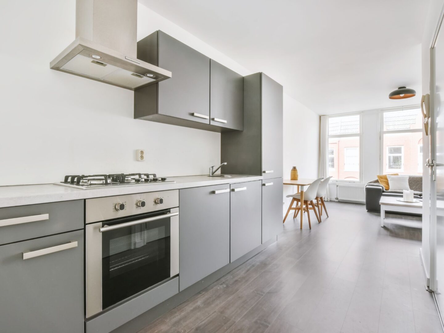 kitchen interior with grey cupboard and drawer fronts.