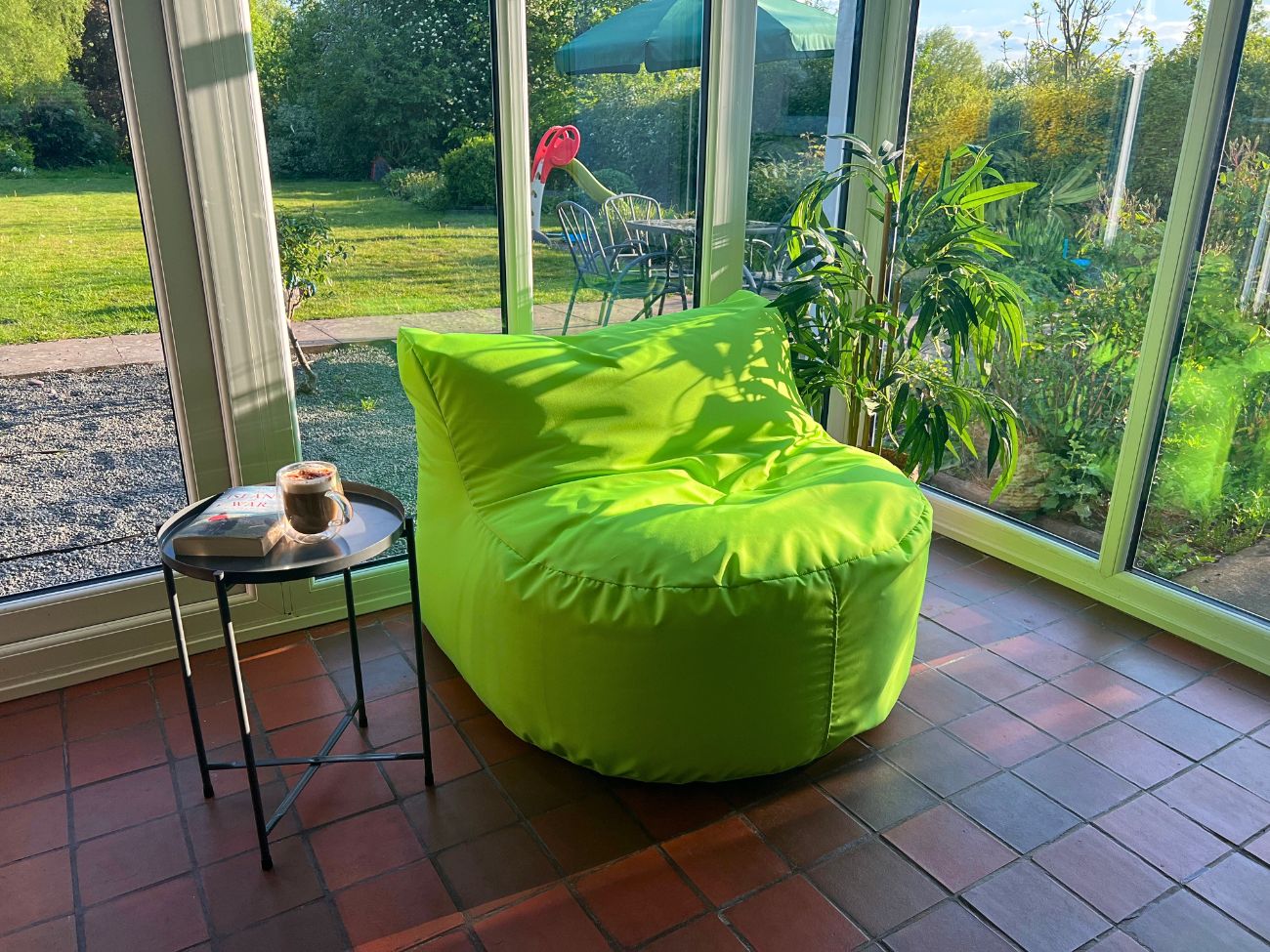 Green bean bag in conservatory 2 1