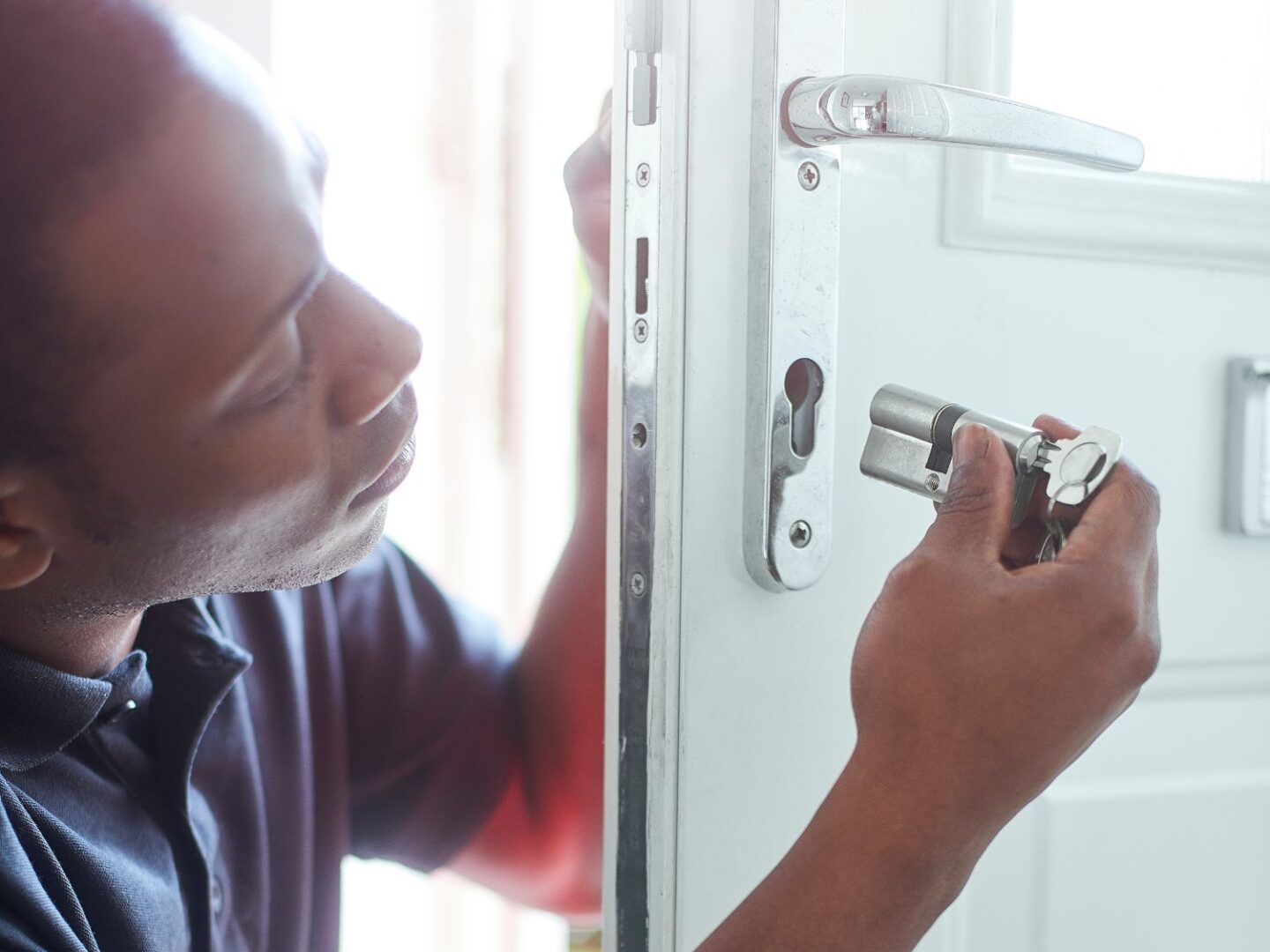 Locksmith changing the door lock