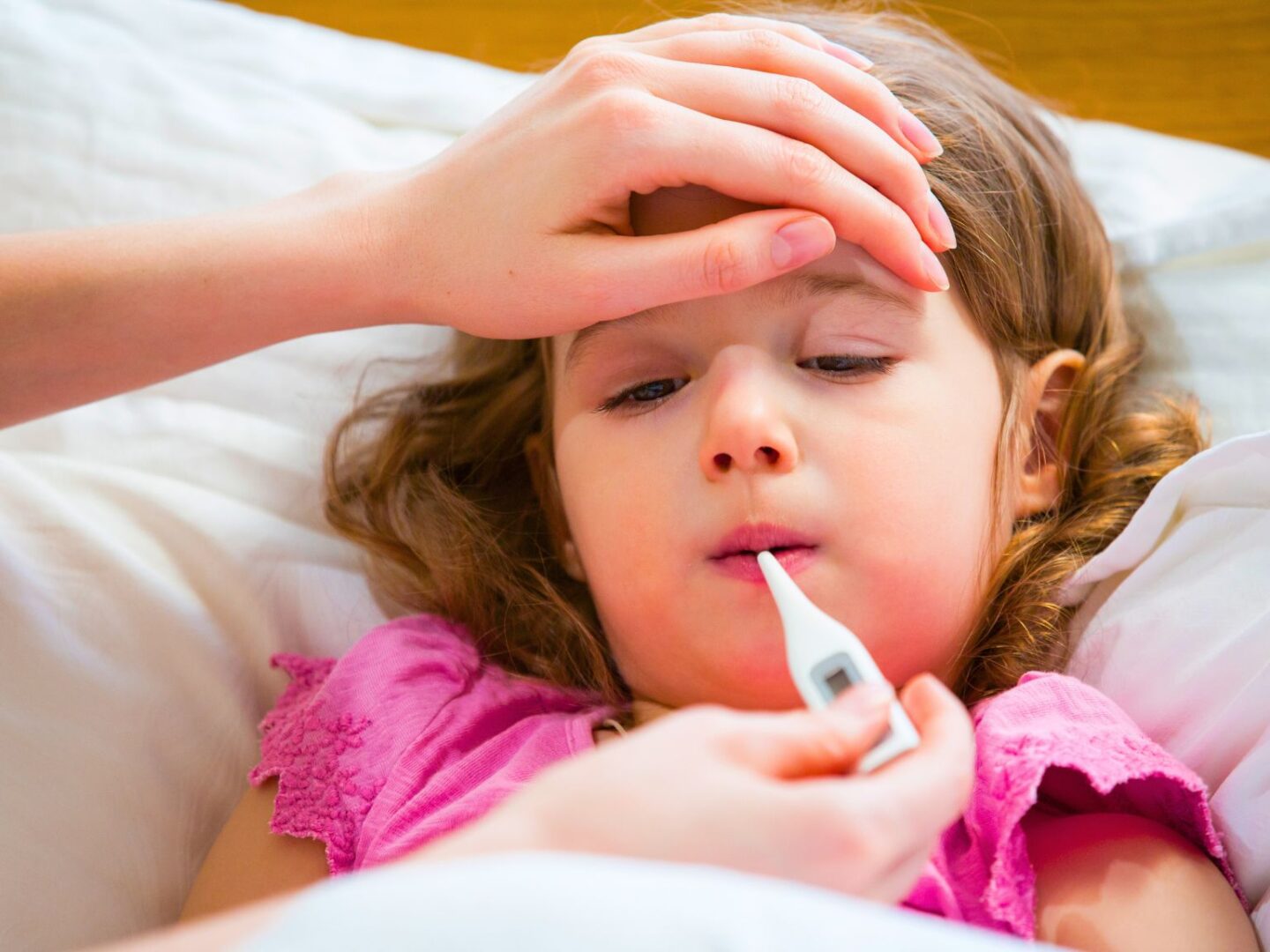 Child having temperature taken