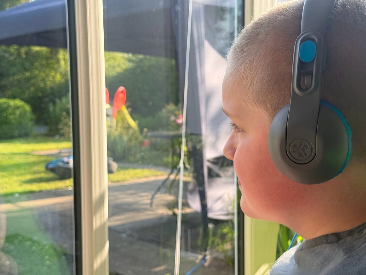 Listening to music on the Jlab kids' headphones.