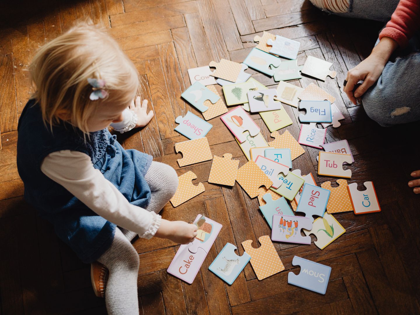 Family playing on herringbone flooring